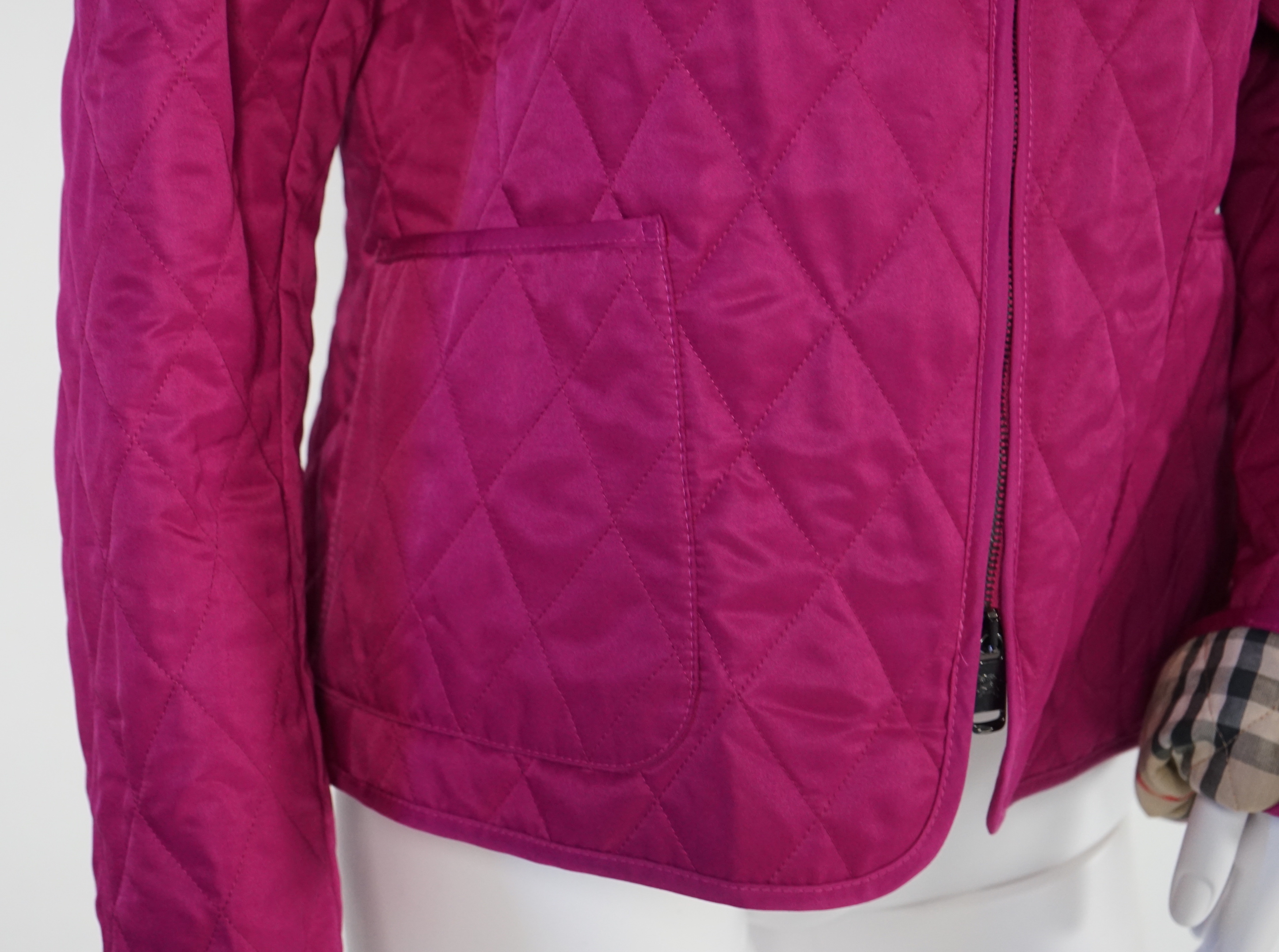 Two Burberry lady's quilted jackets, one pink and the other green, size Medium